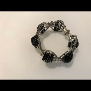 Silver-tone hinged bracelet with black beads